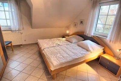Ein Bett oder Betten in einem Zimmer der Unterkunft Strandbiene