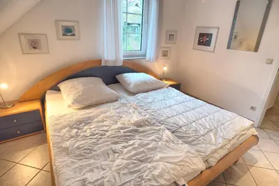 Ein Bett oder Betten in einem Zimmer der Unterkunft Strandbiene
