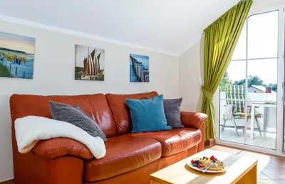 Ein Sitzbereich in der Unterkunft Birkenstraße 7, Wohnung 7