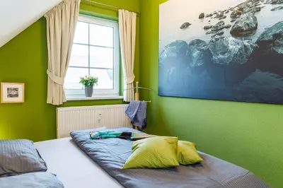 Ein Bett oder Betten in einem Zimmer der Unterkunft Birkenstraße 7, Wohnung 7