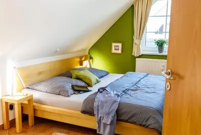 Ein Bett oder Betten in einem Zimmer der Unterkunft Birkenstraße 7, Wohnung 7