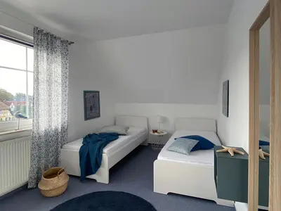 Ein Bett oder Betten in einem Zimmer der Unterkunft Antonia Strandstr 21 Whg 6