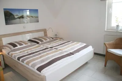 Ein Bett oder Betten in einem Zimmer der Unterkunft Strandstraße 21 Whg 5
