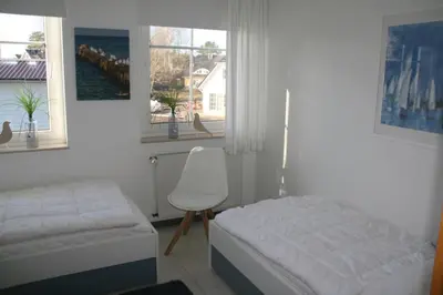 Ein Bett oder Betten in einem Zimmer der Unterkunft Strandstraße 21 Whg 5