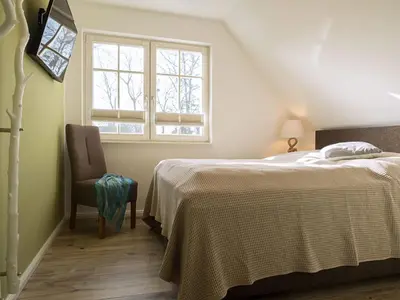 Ein Bett oder Betten in einem Zimmer der Unterkunft Ferienhaus 