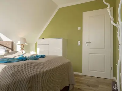 Ein Bett oder Betten in einem Zimmer der Unterkunft Ferienhaus 