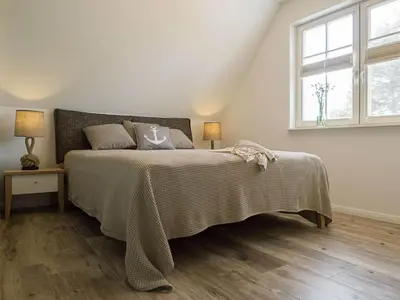 Ein Bett oder Betten in einem Zimmer der Unterkunft Ferienhaus 