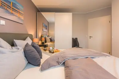 Ein Bett oder Betten in einem Zimmer der Unterkunft Birkenstraße 6 Haus II Whg1