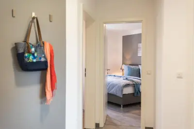 Ein Bett oder Betten in einem Zimmer der Unterkunft Birkenstraße 6 Haus II Whg3