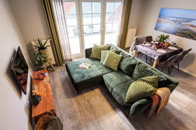 Ein Sitzbereich in der Unterkunft Birkenstraße 6 Haus II Whg5