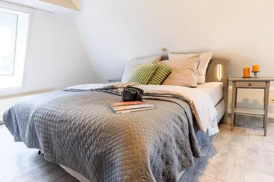 Ein Bett oder Betten in einem Zimmer der Unterkunft Birkenstraße 6 Haus II Whg5