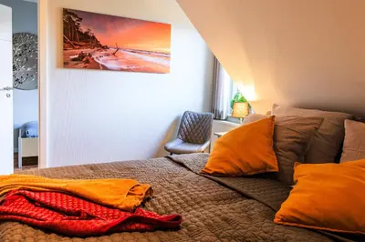 Ein Bett oder Betten in einem Zimmer der Unterkunft Birkenstraße 6 Haus II Whg6