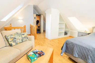 Ein Bett oder Betten in einem Zimmer der Unterkunft Birkenstraße 6 Haus II Whg6