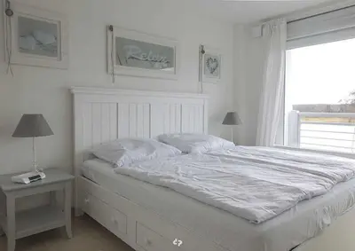 Ein Bett oder Betten in einem Zimmer der Unterkunft SONNENDECK App Nr 19 max 4 Pers