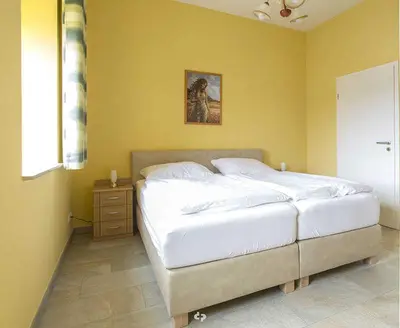 Ein Bett oder Betten in einem Zimmer der Unterkunft SONNENSEGEL App Nr 04 max 3 Pers