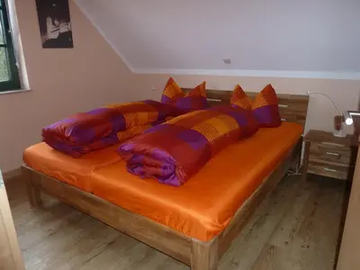Ein Bett oder Betten in einem Zimmer der Unterkunft Ferienwohnung Thum