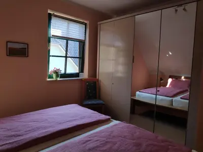 Ein Bett oder Betten in einem Zimmer der Unterkunft Ferienwohnung Thum