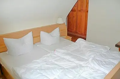 Ein Bett oder Betten in einem Zimmer der Unterkunft Hennig, Otti