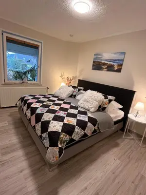 Ein Bett oder Betten in einem Zimmer der Unterkunft Schneider FW 1