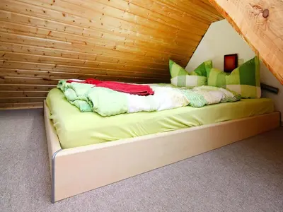 Ein Bett oder Betten in einem Zimmer der Unterkunft Doppelhaushaelfte am Hafen von Neuendorf