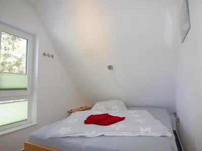 Ein Bett oder Betten in einem Zimmer der Unterkunft Semi-detached house, Zingst