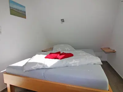 Ein Bett oder Betten in einem Zimmer der Unterkunft Semi-detached house, Zingst