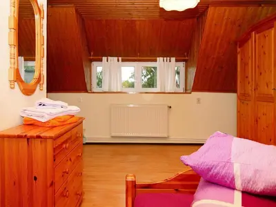 Ein Bett oder Betten in einem Zimmer der Unterkunft Ferienwohnung am Bodstedter Bodden