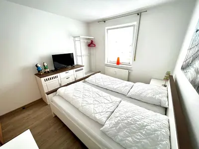 Ein Bett oder Betten in einem Zimmer der Unterkunft Birkenstraße 7 Whg 1