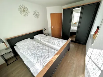 Ein Bett oder Betten in einem Zimmer der Unterkunft Birkenstraße 7 Whg 1