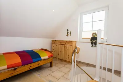 Ein Bett oder Betten in einem Zimmer der Unterkunft Deichweg 12