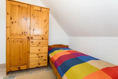 Ein Bett oder Betten in einem Zimmer der Unterkunft Deichweg 12