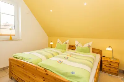 Ein Bett oder Betten in einem Zimmer der Unterkunft Deichweg 12