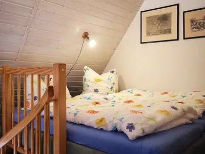 Ein Bett oder Betten in einem Zimmer der Unterkunft Ferienhaus Weinhardt - Whg 1