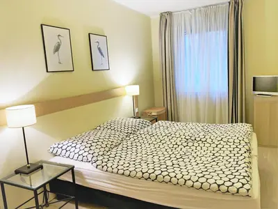 Ein Bett oder Betten in einem Zimmer der Unterkunft Strandperle Zingst - Ap 409