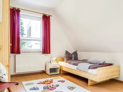 Ein Bett oder Betten in einem Zimmer der Unterkunft Max Hünten Weg 2
