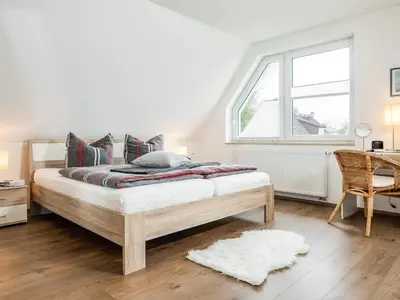 Ein Bett oder Betten in einem Zimmer der Unterkunft Max Hünten Weg 2