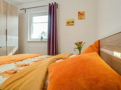 Ein Bett oder Betten in einem Zimmer der Unterkunft Wiesenstraße 2 Whg 1