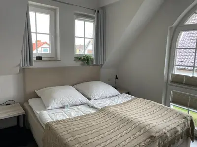 Ein Bett oder Betten in einem Zimmer der Unterkunft Hafenstraße 9 Whg 5
