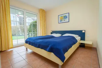 Ein Bett oder Betten in einem Zimmer der Unterkunft Birkenstraße 7 Whg 2