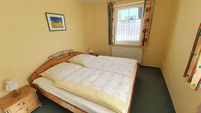 Ein Bett oder Betten in einem Zimmer der Unterkunft Birkenstraße 7 Whg 3