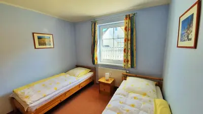 Ein Bett oder Betten in einem Zimmer der Unterkunft Birkenstraße 7 Whg 3