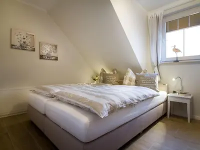 Ein Bett oder Betten in einem Zimmer der Unterkunft Whg 03 - Keekwind
