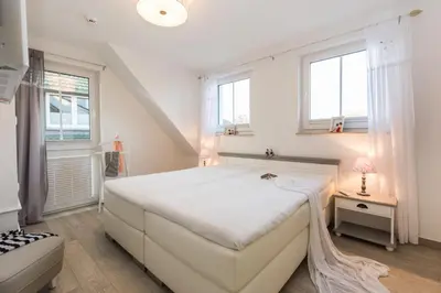 Ein Bett oder Betten in einem Zimmer der Unterkunft Whg 06 - De Fischer un sin Fru