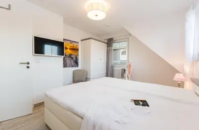 Ein Bett oder Betten in einem Zimmer der Unterkunft Whg 06 - De Fischer un sin Fru