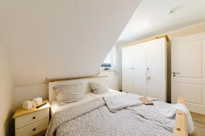 Ein Bett oder Betten in einem Zimmer der Unterkunft Whg 12 - Kranichrast