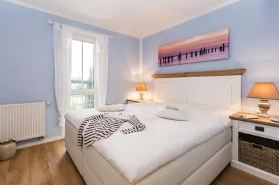 Ein Bett oder Betten in einem Zimmer der Unterkunft Whg 13 - De Fischer un sin Fru