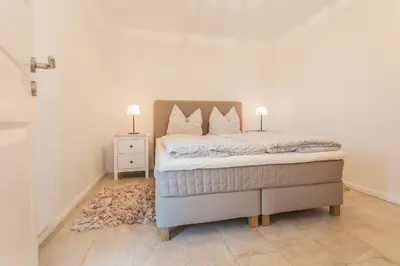 Ein Bett oder Betten in einem Zimmer der Unterkunft Whg 05 - Boddenangler