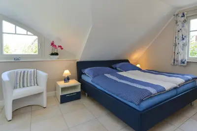 Ein Bett oder Betten in einem Zimmer der Unterkunft Ferienhaus Strandschnecke