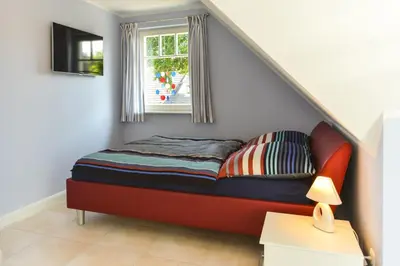 Ein Bett oder Betten in einem Zimmer der Unterkunft Ferienhaus Strandschnecke