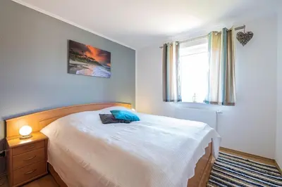 Ein Bett oder Betten in einem Zimmer der Unterkunft Hoppenberg 5a